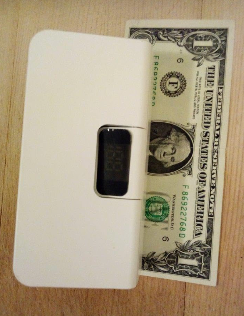 Actual size of the LockNSeal sealer next to a $1 bill